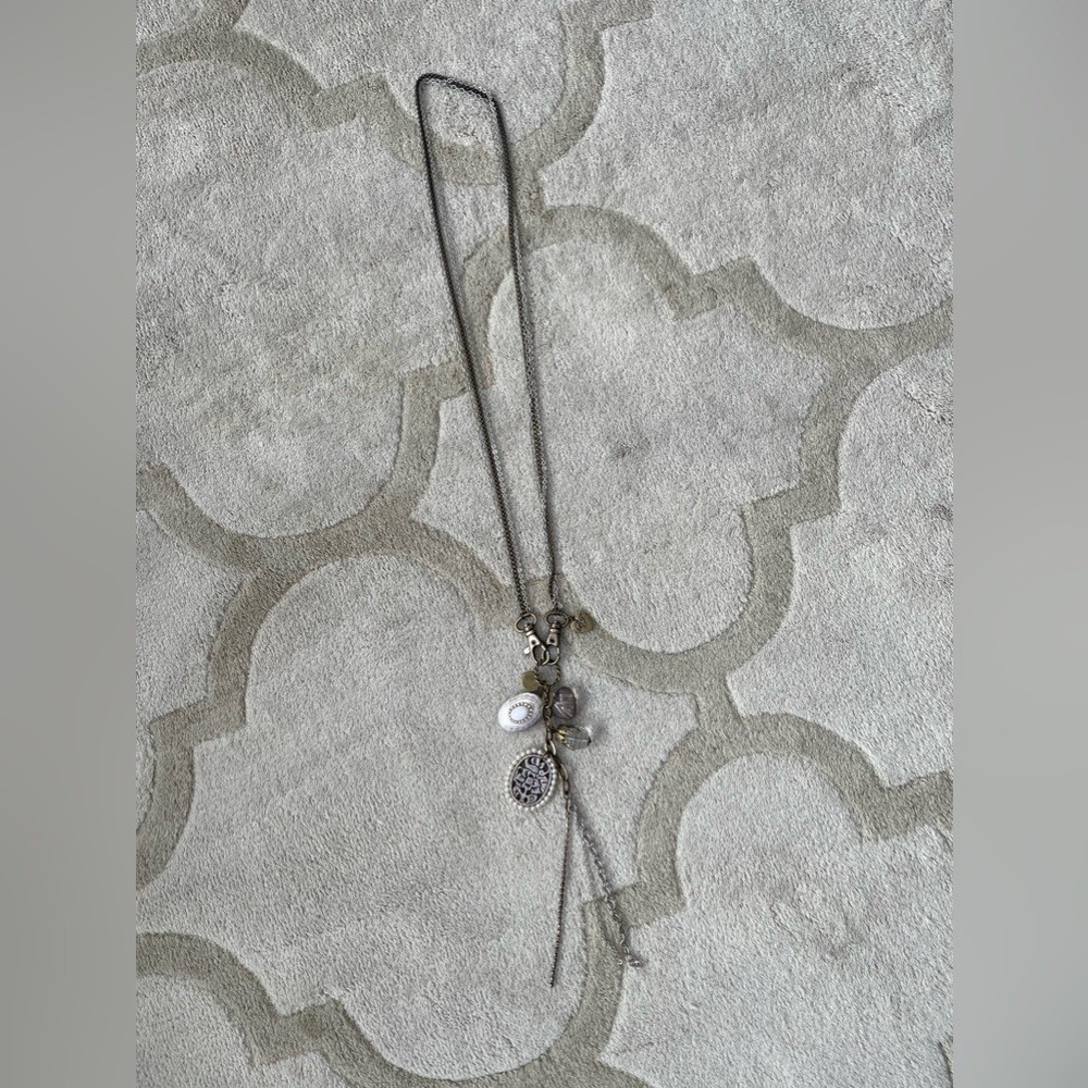 Betsy Johnson long pendant in silver and brushed brass colour